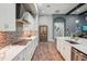 Contemporary kitchen with tile backsplash, stainless steel appliances, and quartz countertops at 13069 Paddock Wood Pl, Riverview, FL 33579