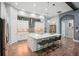 Bright kitchen with large island, quartz countertops, mosaic backsplash, and stainless steel appliances at 13069 Paddock Wood Pl, Riverview, FL 33579
