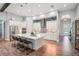 Large kitchen with center island, stainless appliances, mosaic backsplash, and wood-look floors at 13069 Paddock Wood Pl, Riverview, FL 33579