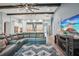 Open-concept living room flowing into the kitchen, with wood-look floors, and comfortable seating area at 13069 Paddock Wood Pl, Riverview, FL 33579