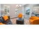 Cozy living room featuring stylish furniture, a sleek black sofa, and a view into an adjacent home office at 13069 Paddock Wood Pl, Riverview, FL 33579