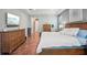Main bedroom showcases wood floors, furniture, and tray ceilings at 13069 Paddock Wood Pl, Riverview, FL 33579