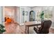 Cozy home office with custom woodwork, plantation shutters, and an elegant grandfather clock at 13069 Paddock Wood Pl, Riverview, FL 33579