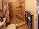 Bathroom with a tiled walk-in shower, and stylish granite vanity at 1363 Overlea Dr, Dunedin, FL 34698