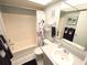 Bathroom with a shower-tub combo, white tile, and functional sink at 1363 Overlea Dr, Dunedin, FL 34698
