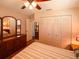 Secondary bedroom featuring a queen bed, dresser, and ample closet space at 1363 Overlea Dr, Dunedin, FL 34698