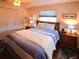 Bedroom with wood floors, a comfortable bed, and lots of natural light at 1363 Overlea Dr, Dunedin, FL 34698