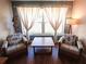 Inviting living room featuring comfortable seating, a stylish table, and lots of natural light at 1363 Overlea Dr, Dunedin, FL 34698
