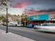 The exterior of the restaurant, Casa Tina, with cars parked out front and palm trees at 1363 Overlea Dr, Dunedin, FL 34698