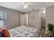 Comfortable bedroom featuring ceiling fan, adjacent bathroom and closet at 1400 Gandy N Blvd # 502, St Petersburg, FL 33702