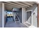 Exterior entrance featuring stairs and a gray door, offering access to the property at 1400 Gandy N Blvd # 502, St Petersburg, FL 33702