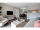 Comfortable living room featuring modern decor, wood floors, and a view into the dining area at 1400 Gandy N Blvd # 502, St Petersburg, FL 33702