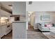 Open concept living space combining the kitchen and living room with modern flooring and lighting at 1400 Gandy N Blvd # 502, St Petersburg, FL 33702