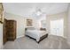 Bedroom with neutral decor, a desk, and built-in closet space at 15702 Muirfield Dr, Odessa, FL 33556