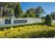 The Eagles community sign with well-maintained landscaping on a sunny day at 15702 Muirfield Dr, Odessa, FL 33556