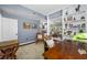 Cozy home office with built-in bookshelves, hardwood floors, and lots of natural light at 15702 Muirfield Dr, Odessa, FL 33556