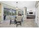 Open concept kitchen with breakfast nook overlooking the pool and lanai at 15702 Muirfield Dr, Odessa, FL 33556