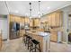 Well-equipped kitchen with stainless steel appliances, a center island, and custom cabinets at 15702 Muirfield Dr, Odessa, FL 33556