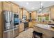 Well-equipped kitchen with stainless steel appliances, granite countertops, and ample cabinet space at 15702 Muirfield Dr, Odessa, FL 33556