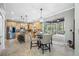 Bright, open kitchen with breakfast nook and views of the screened-in lanai at 15702 Muirfield Dr, Odessa, FL 33556