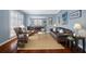Elegant living room with hardwood floors, stylish furnishings, and plantation shutters at 15702 Muirfield Dr, Odessa, FL 33556