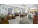 Spacious living room with hardwood floors, comfortable seating, and elegant decor at 15702 Muirfield Dr, Odessa, FL 33556