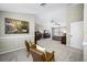 Large main bedroom with sitting area, ceiling fan, and carpet at 15702 Muirfield Dr, Odessa, FL 33556