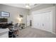 Office with modern desk, storage, and a ceiling fan at 15702 Muirfield Dr, Odessa, FL 33556