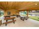 Community picnic pavilion with picnic tables and views of tennis and basketball courts at 15702 Muirfield Dr, Odessa, FL 33556