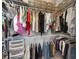 Spacious walk-in closet with an abundance of storage space using racks and shelves at 15702 Muirfield Dr, Odessa, FL 33556