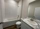 Bathroom featuring a tub, shower combination, and a vanity with a marble countertop at 17049 James Trl, Parrish, FL 34219