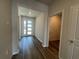 Inviting home foyer with durable flooring and natural light streaming through the front door at 17049 James Trl, Parrish, FL 34219