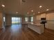 Bright kitchen with an island, stainless appliances, and a view of the serene lake at 17049 James Trl, Parrish, FL 34219