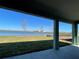 Covered patio featuring picturesque views of the water, perfect for relaxing outdoors at 17049 James Trl, Parrish, FL 34219
