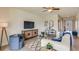 Comfortable living room with a large flat-screen TV, modern furniture, and stylish decor at 17053 James Trl, Parrish, FL 34219