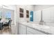 Bathroom featuring dual sinks and marble countertops at 17114 James Trl, Parrish, FL 34219