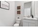 Powder room featuring marble countertops and modern fixtures at 17114 James Trl, Parrish, FL 34219