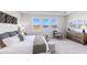 Bright bedroom features plush carpeting and a beautiful view of the lake at 17114 James Trl, Parrish, FL 34219