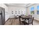 Dining area features wood floors and sample of home's features at 17114 James Trl, Parrish, FL 34219