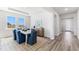 Tastefully decorated dining area with modern furnishings, wood floors, and ample natural light at 17114 James Trl, Parrish, FL 34219