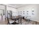 Dining area features wood floors and sample of home's features at 17114 James Trl, Parrish, FL 34219