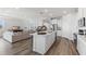 Spacious open concept kitchen with a large island, stainless steel appliances, and lots of natural light at 17114 James Trl, Parrish, FL 34219