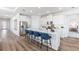 Modern kitchen with white cabinets, stainless steel appliances, and a center island with seating at 17114 James Trl, Parrish, FL 34219