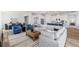 Open-concept living and dining area with contemporary decor, wood floors, and plenty of natural light at 17114 James Trl, Parrish, FL 34219