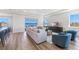 Bright and airy living room featuring modern furnishings, wood floors, and a stunning waterfront view at 17114 James Trl, Parrish, FL 34219