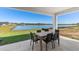 Relaxing patio overlooking a large pond, perfect for outdoor dining at 17114 James Trl, Parrish, FL 34219