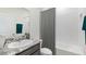 Bathroom featuring a granite countertop, framed mirror, neutral walls, and a shower-tub combination at 17126 James Trl, Parrish, FL 34219