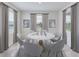 Elegant dining room featuring a round table, stylish chairs, and natural light from two windows at 17126 James Trl, Parrish, FL 34219