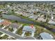 Desirable home with waterfront views, surrounded by meticulously maintained lawns and mature trees at 1805 Columbine Pl, Sun City Center, FL 33573