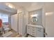 Bright bathroom features updated vanity, modern lighting, and neutral wall color at 1805 Columbine Pl, Sun City Center, FL 33573